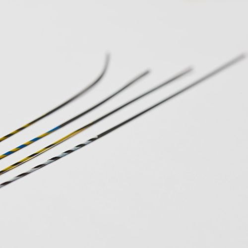 a close-up of several thin black and yellow sticks