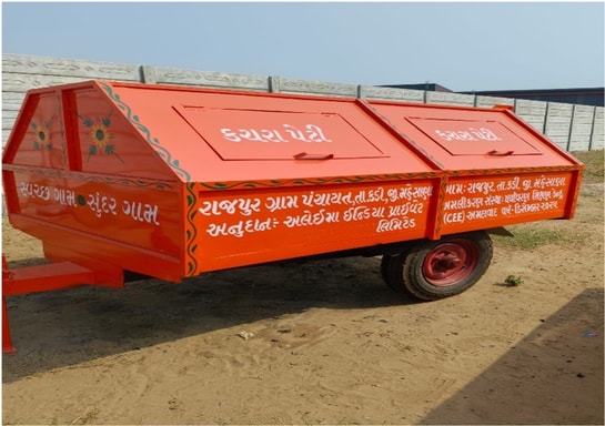 an orange trailer with white writing on it