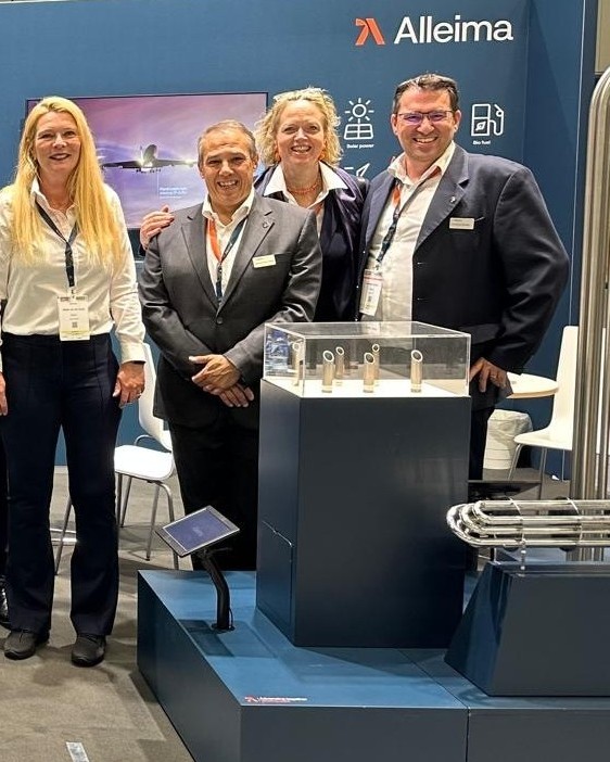 a group of people standing in front of a display