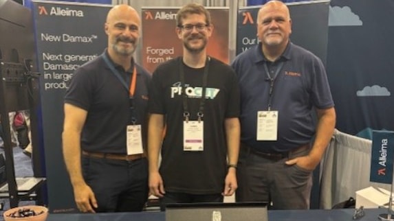 a group of men standing in front of a table