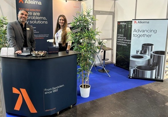 a person and person standing in front of a booth