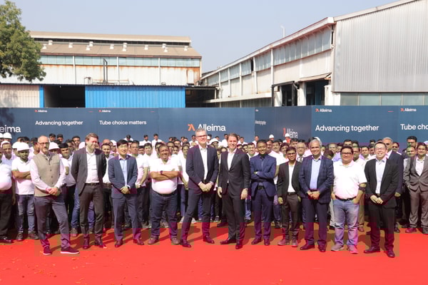 a group of people standing together on a red carpet