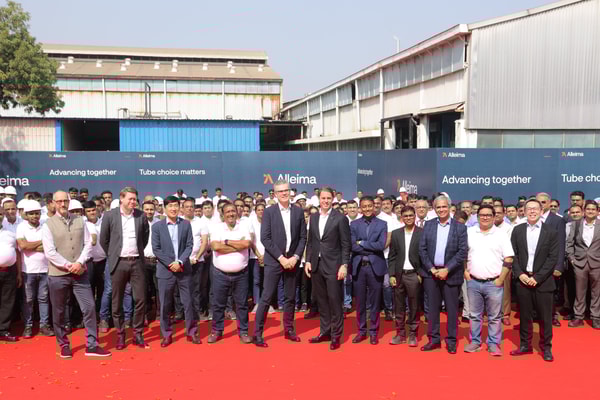 a group of people standing together on a red carpet
