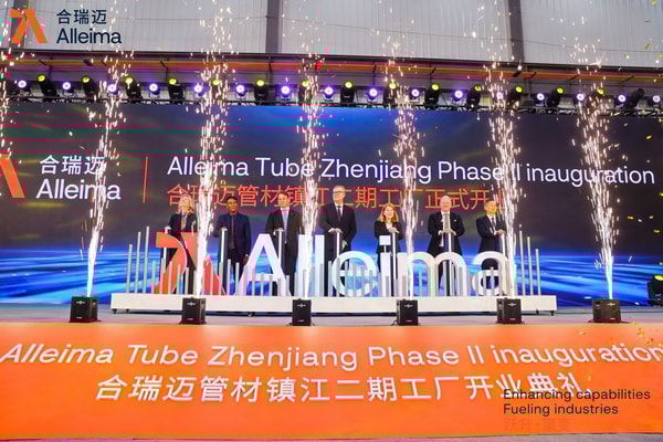 a group of people on a stage with fireworks