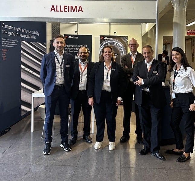 a group of people standing in front of a sign