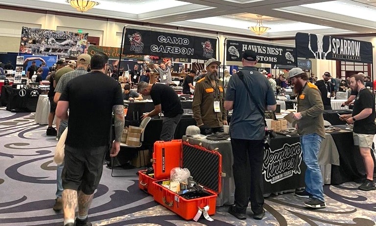 a group of people in a room with a variety of objects