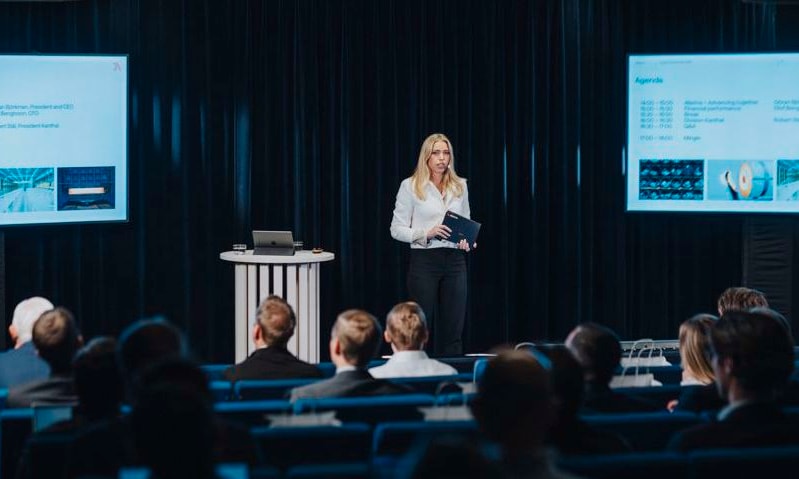 a person standing in front of a group of people