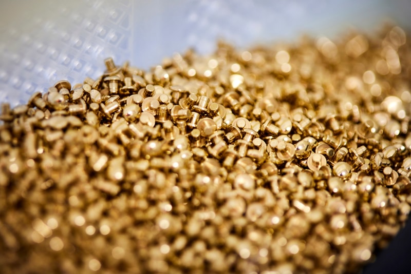 a pile of gold screws