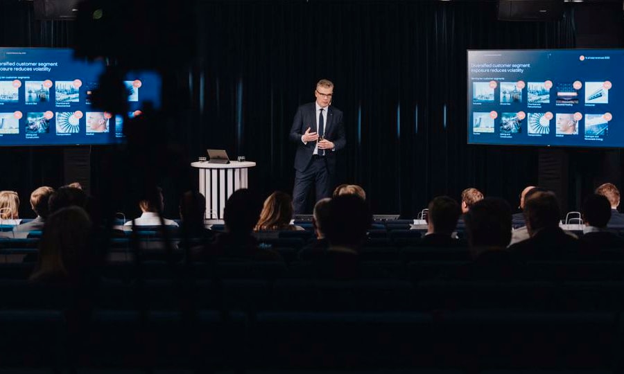 a person standing in front of a group of people