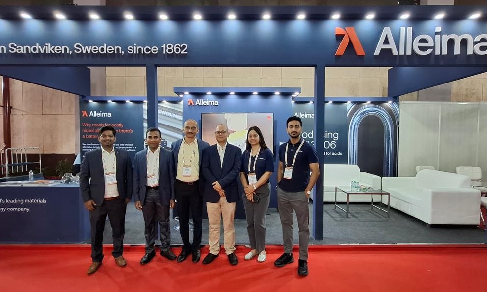 a group of people standing in front of a sign