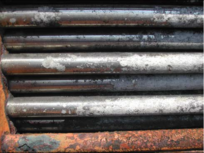 Duplex steel has a good surface in comparison with corroded carbon steel tie-rod (red colour tube at bottom) in overhead condenser after seven years of service.